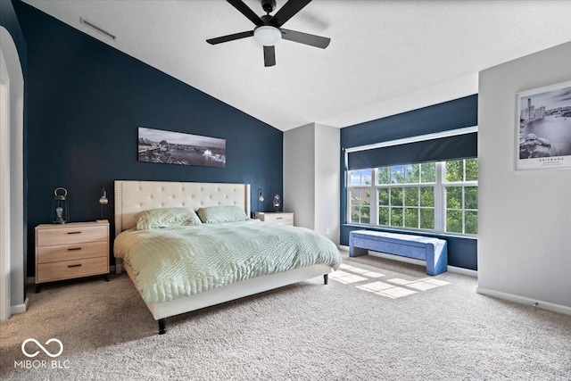 11509 Reagan Dr, Fishers, IN 46038 - carpeted bedroom with vaulted ceiling, arched walkways, baseboards, and a ceiling fan