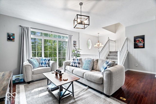 11509 Reagan Dr, Fishers, IN 46038 - living room featuring a chandelier, hardwood / wood-style floors, baseboards, and stairs