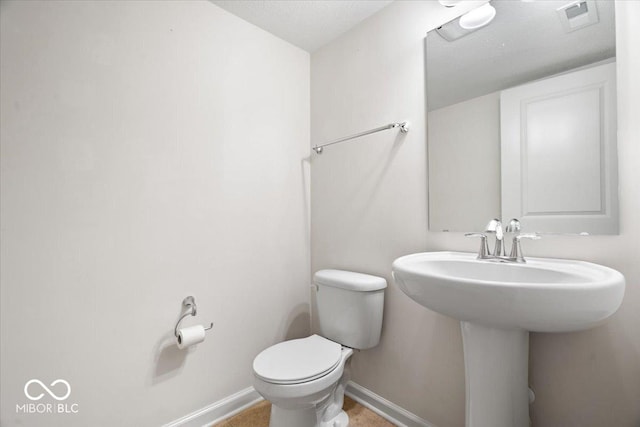 11509 Reagan Dr, Fishers, IN 46038 - half bathroom featuring toilet and baseboards