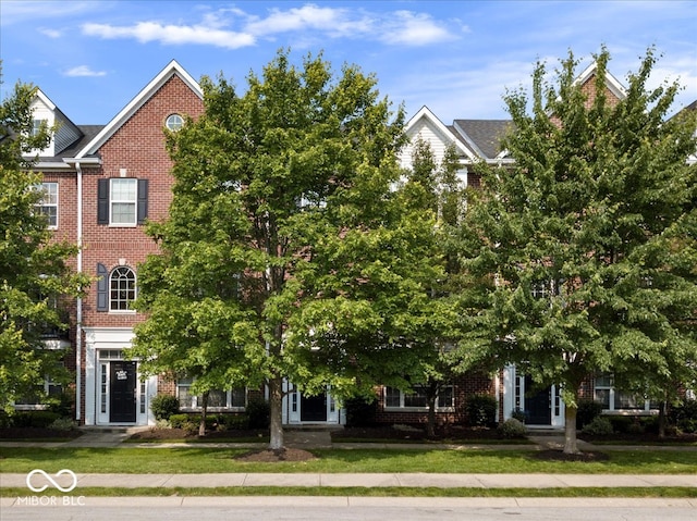 11509 Reagan Dr, Fishers, IN 46038 - view of front of house with brick siding and a front yard