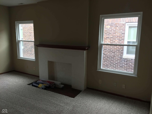 59 W Fall Creek Parkway S Drive, Indianapolis, IN 46208 - unfurnished living room with healthy amount of natural light, carpet flooring, and baseboards