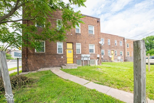 59 W Fall Creek Parkway S Drive, Indianapolis, IN 46208 - view of front of property with a front yard and brick siding