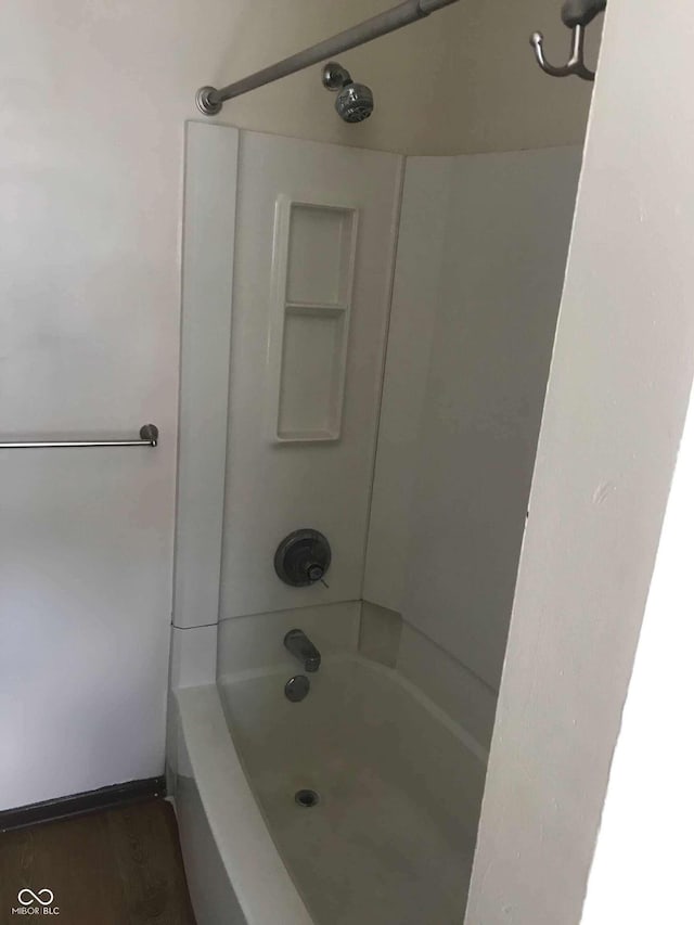 59 W Fall Creek Parkway S Drive, Indianapolis, IN 46208 - bathroom with bathing tub / shower combination, baseboards, and wood finished floors