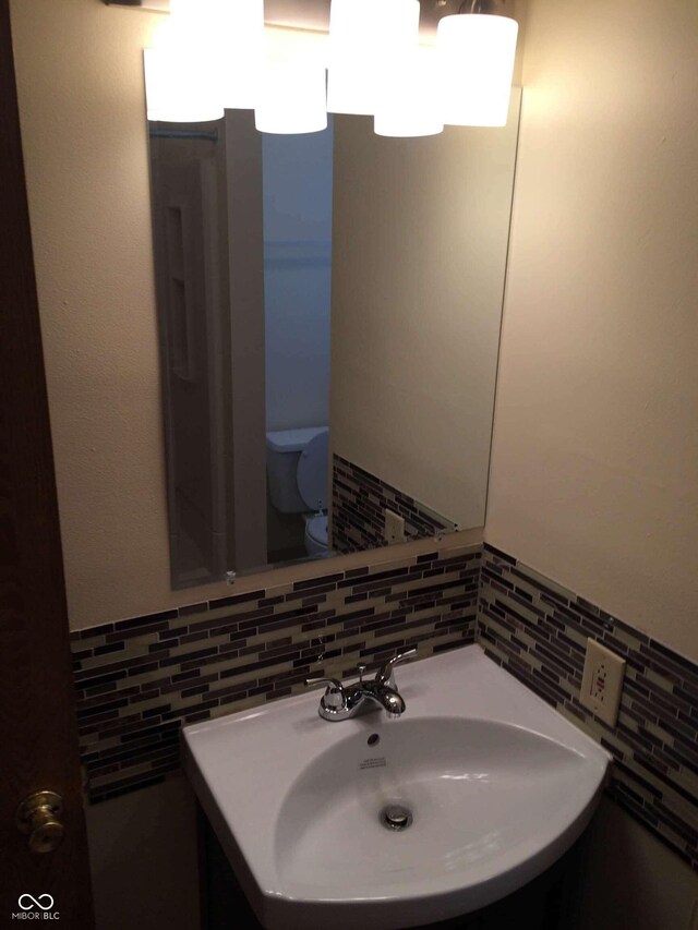 59 W Fall Creek Parkway S Drive, Indianapolis, IN 46208 - half bath with tile walls, toilet, and vanity