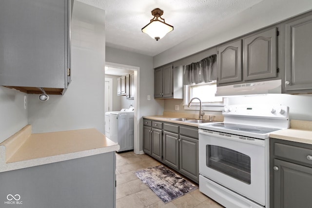 141 S 9th Ave, Beech Grove, IN 46107 - kitchen featuring white electric stove, gray cabinets, a sink, and separate washer and dryer