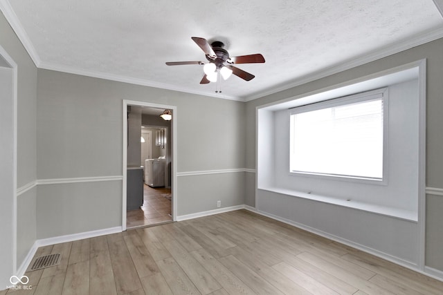 141 S 9th Ave, Beech Grove, IN 46107 - unfurnished room featuring ceiling fan, light wood-type flooring, baseboards, and crown molding