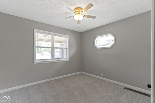 141 S 9th Ave, Beech Grove, IN 46107 - carpeted spare room with a ceiling fan, baseboards, and a textured ceiling