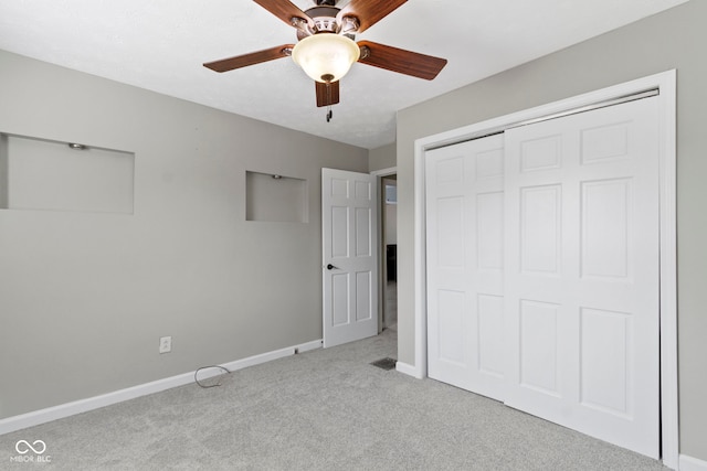 141 S 9th Ave, Beech Grove, IN 46107 - unfurnished bedroom featuring carpet floors, baseboards, a closet, and a ceiling fan