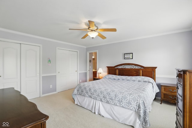 16802 Oak Manor Dr, Westfield, IN 46074 - bedroom featuring light colored carpet, two closets, crown molding, baseboards, and a ceiling fan