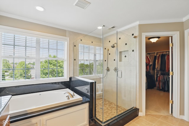 16802 Oak Manor Dr, Westfield, IN 46074 - bathroom featuring a garden tub, a stall shower, ornamental molding, tile patterned floors, and a walk in closet