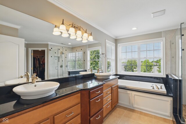 16802 Oak Manor Dr, Westfield, IN 46074 - full bathroom featuring double vanity, a shower stall, a bath, ornamental molding, and a walk in closet