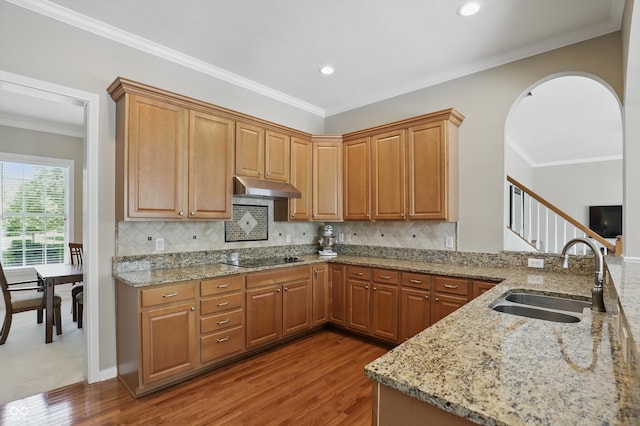 16802 Oak Manor Dr, Westfield, IN 46074 - kitchen featuring a sink, wood finished floors, under cabinet range hood, light stone counters, and recessed lighting