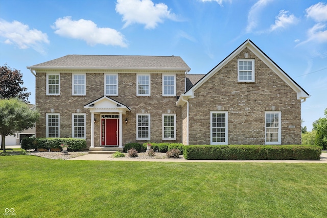 16802 Oak Manor Dr, Westfield, IN 46074 - colonial-style house featuring a front lawn and brick siding