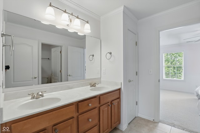 16802 Oak Manor Dr, Westfield, IN 46074 - bathroom featuring double vanity, tile patterned floors, crown molding, baseboards, and ensuite bathroom