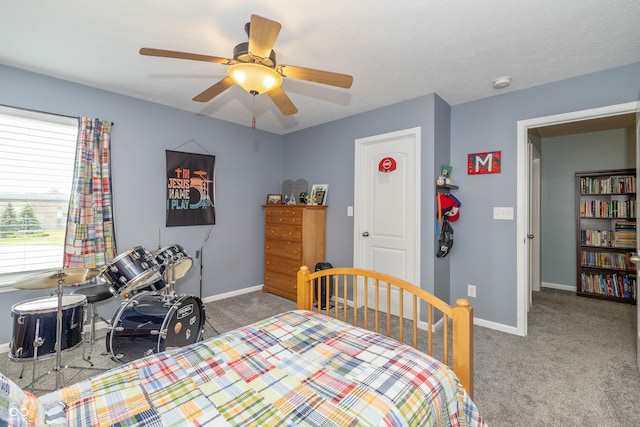 1696 Woodfield Dr, Greenwood, IN 46143 - bedroom featuring carpet flooring, baseboards, and a ceiling fan
