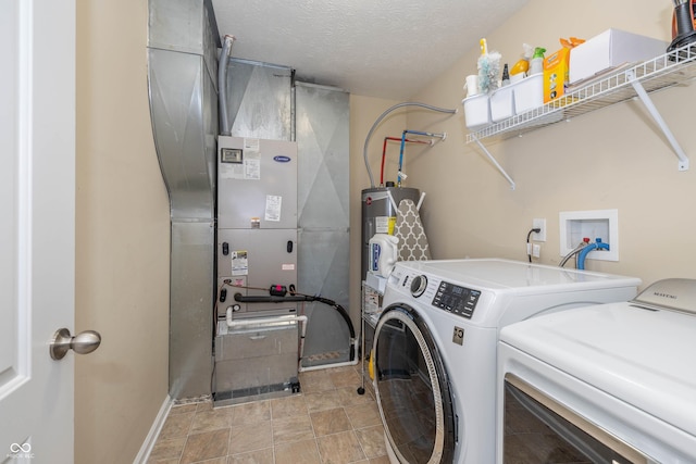 1696 Woodfield Dr, Greenwood, IN 46143 - washroom with washer and dryer, a textured ceiling, baseboards, water heater, and heating unit