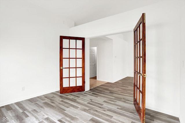 3371 Weathered Rock Cir, Kokomo, IN 46902 - spare room featuring wood finished floors and french doors
