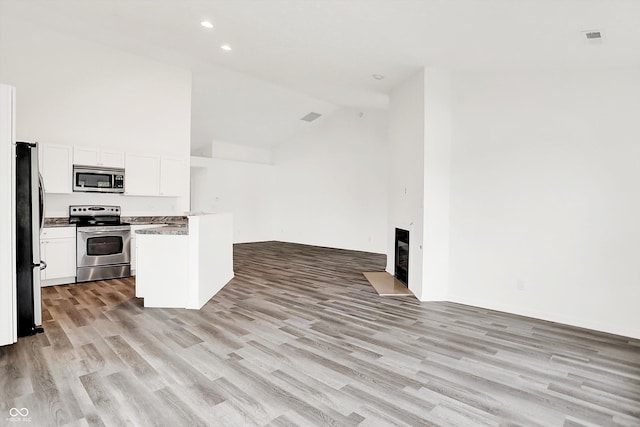 3371 Weathered Rock Cir, Kokomo, IN 46902 - kitchen featuring appliances with stainless steel finishes, open floor plan, light wood-type flooring, white cabinetry, and recessed lighting