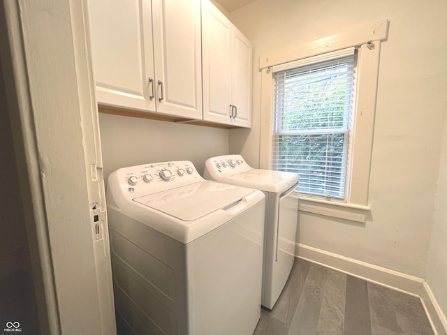 38 N Irvington Ave, Indianapolis, IN 46219 - laundry room featuring independent washer and dryer, cabinet space, and wood finished floors