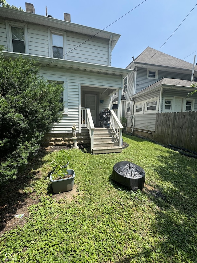 38 N Irvington Ave, Indianapolis, IN 46219 - rear view of house featuring a chimney