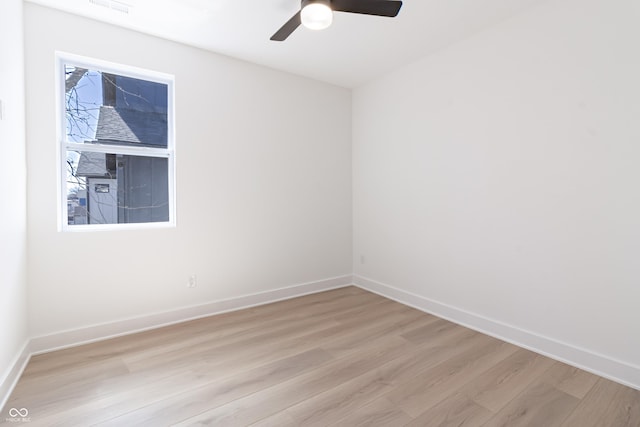 2051 Columbia Ave, Indianapolis, IN 46202 - spare room with light wood-style flooring, ceiling fan, and baseboards