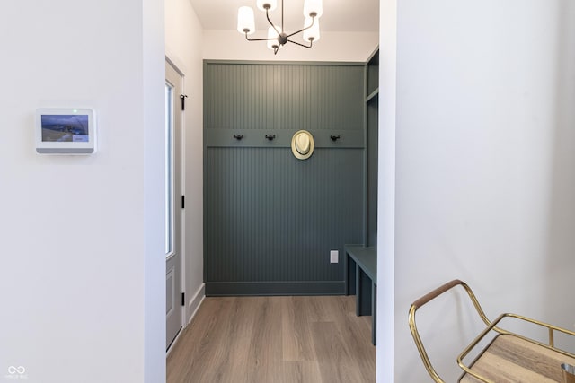 2051 Columbia Ave, Indianapolis, IN 46202 - mudroom with light wood-style flooring and a chandelier