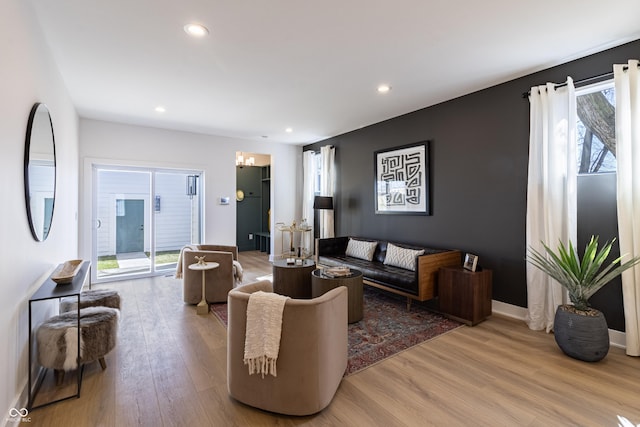 2051 Columbia Ave, Indianapolis, IN 46202 - living room with wood finished floors, recessed lighting, baseboards, and a chandelier