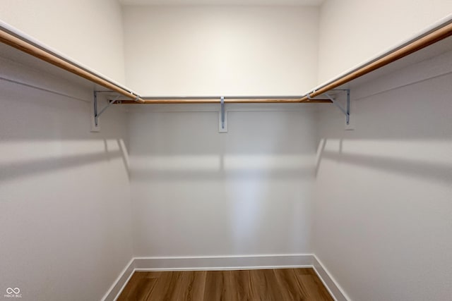 2051 Columbia Ave, Indianapolis, IN 46202 - walk in closet featuring dark wood-type flooring
