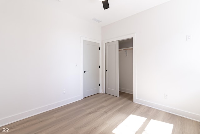 2051 Columbia Ave, Indianapolis, IN 46202 - unfurnished bedroom with light wood-style floors, baseboards, a closet, and ceiling fan
