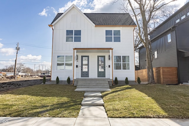 2051 Columbia Ave, Indianapolis, IN 46202 - view of front of property featuring board and batten siding, entry steps, and a shingled roof