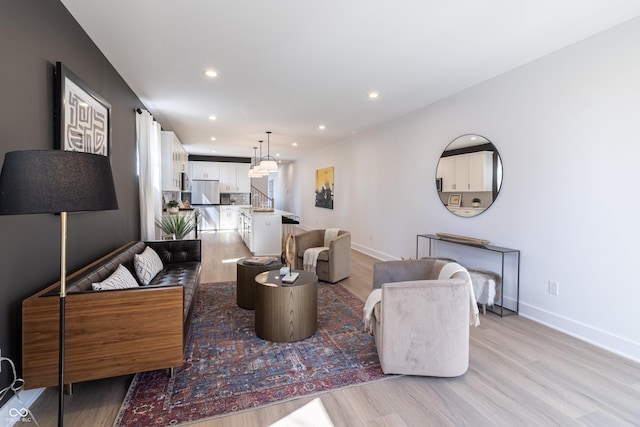 2051 Columbia Ave, Indianapolis, IN 46202 - living room featuring light wood-type flooring, recessed lighting, and baseboards