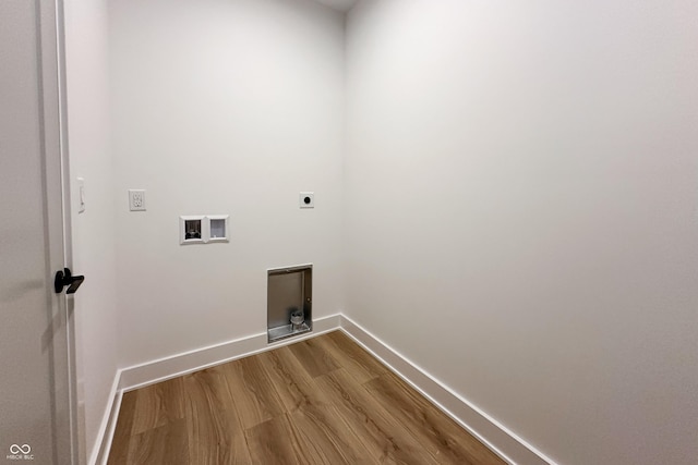2053 Columbia Ave, Indianapolis, IN 46202 - laundry area featuring electric dryer hookup, dark wood finished floors, hookup for a washing machine, and baseboards