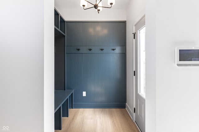 2053 Columbia Ave, Indianapolis, IN 46202 - mudroom with light wood-style floors, a chandelier, and baseboards