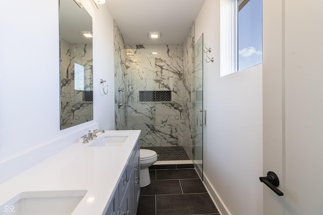 2053 Columbia Ave, Indianapolis, IN 46202 - full bath with a marble finish shower, toilet, double vanity, and tile patterned flooring