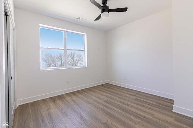 2053 Columbia Ave, Indianapolis, IN 46202 - unfurnished bedroom with wood finished floors, baseboards, and ceiling fan