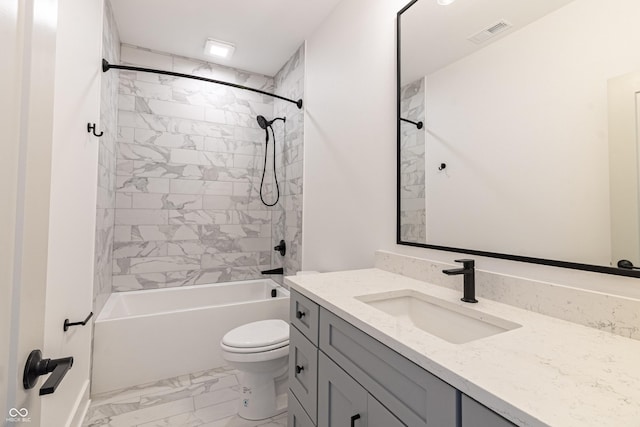 2053 Columbia Ave, Indianapolis, IN 46202 - full bathroom featuring vanity, marble look tile flooring, toilet, and shower / tub combination