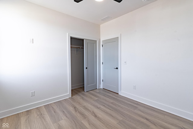 2053 Columbia Ave, Indianapolis, IN 46202 - unfurnished bedroom featuring light wood-style flooring, baseboards, a closet, and ceiling fan