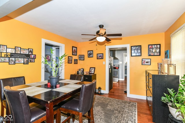 1619 E Bradbury Ave, Indianapolis, IN 46203 - dining space with wood finished floors, ceiling fan, and baseboards