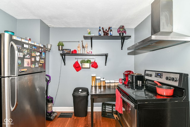 1619 E Bradbury Ave, Indianapolis, IN 46203 - kitchen with freestanding refrigerator, electric range, wall chimney exhaust hood, wood finished floors, and open shelves