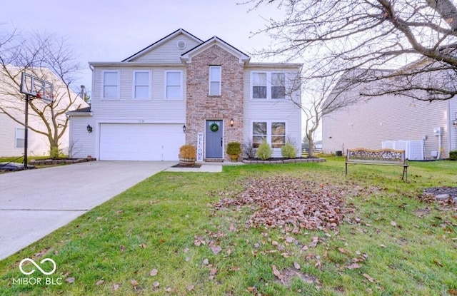 10197 Apple Blossom Cir, Fishers, IN 46038 - traditional home with an attached garage, driveway, a front yard, and brick siding