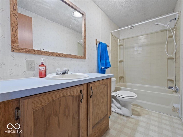 1447 NE Kutenai Trl, Greensburg, IN 47240 - bathroom with tile patterned floors, vanity, a textured ceiling, bathing tub / shower combination, and toilet