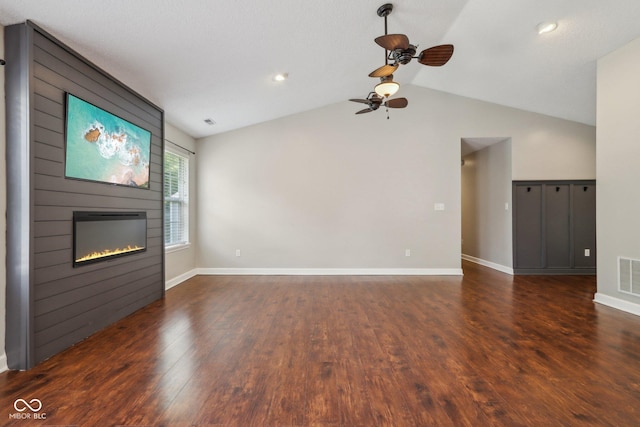 17357 Austrian Pine Way, Westfield, IN 46074 - unfurnished living room featuring lofted ceiling, a fireplace, dark wood finished floors, ceiling fan, and baseboards