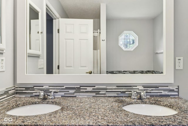 17357 Austrian Pine Way, Westfield, IN 46074 - bathroom featuring double vanity and decorative backsplash