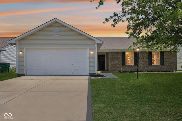 17357 Austrian Pine Way, Westfield, IN 46074 - view of front of home with driveway, a yard, an attached garage, and brick siding