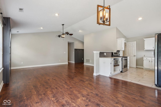 17357 Austrian Pine Way, Westfield, IN 46074 - unfurnished living room with vaulted ceiling, ceiling fan, light wood finished floors, baseboards, and recessed lighting