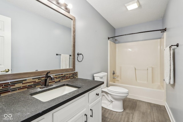 17357 Austrian Pine Way, Westfield, IN 46074 - full bath with decorative backsplash, vanity, bathing tub / shower combination, wood finished floors, and toilet