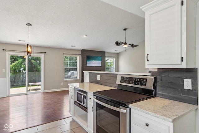 17357 Austrian Pine Way, Westfield, IN 46074 - kitchen featuring stainless steel appliances, backsplash, and healthy amount of natural light