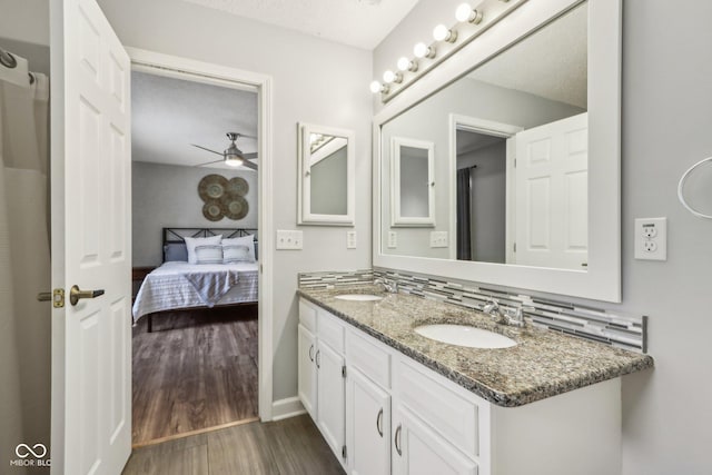 17357 Austrian Pine Way, Westfield, IN 46074 - full bath with connected bathroom, double vanity, wood finished floors, ceiling fan, and baseboards