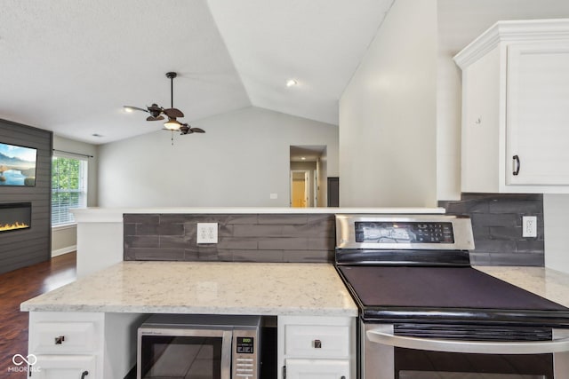 17357 Austrian Pine Way, Westfield, IN 46074 - kitchen with appliances with stainless steel finishes, tasteful backsplash, a ceiling fan, white cabinets, and vaulted ceiling