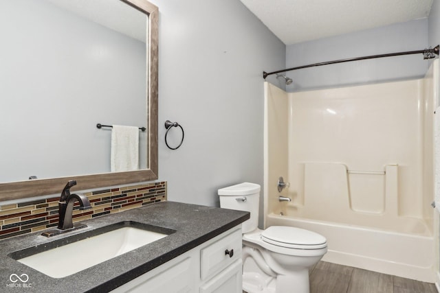 17357 Austrian Pine Way, Westfield, IN 46074 - full bath with decorative backsplash, vanity, toilet,  shower combination, and wood finished floors